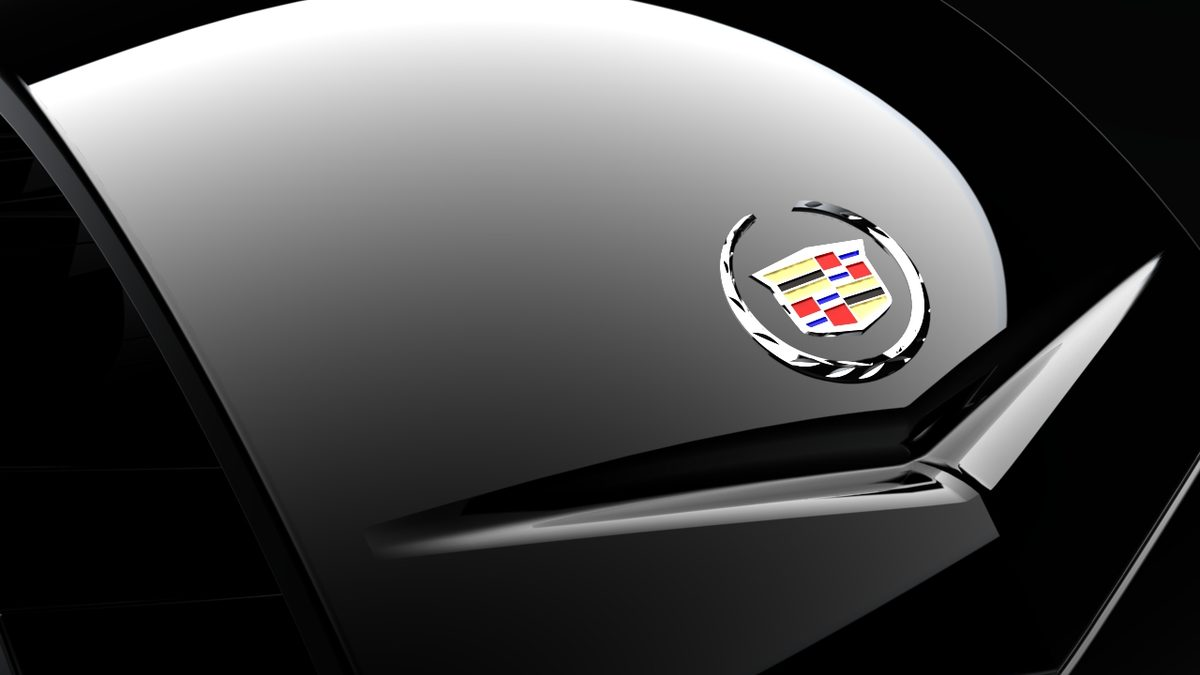 Close-up of the Dextera bracelet showing the Cadillac crest on the reflective faceted surface.