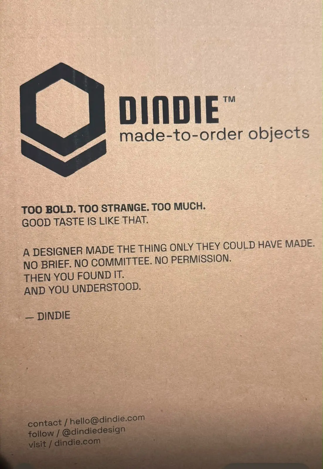 Dindie cardboard box printed with: Too bold. Too strange. Too much. Good taste is like that.