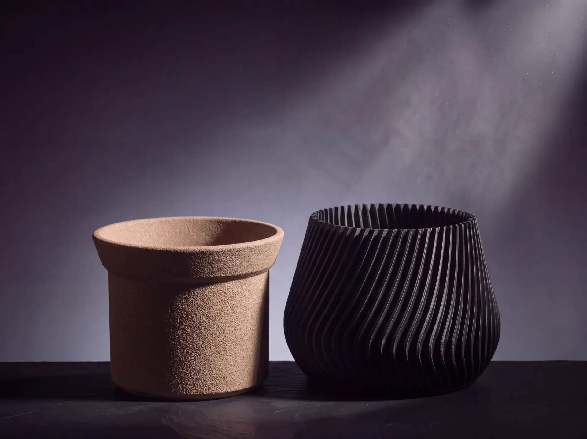 The two parts side by side: the textured terracotta inner container and the ribbed outer body.